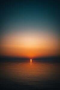 body of water during sunset